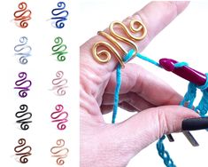 a person is holding some type of string with scissors in their left hand and two different colors of yarn on the other side