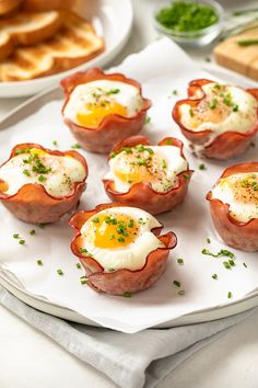 eggs in bread cups with bacon on the side