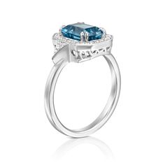 The Katerina ring is our show-stopping piece and has a large 1.8CT Blue Topaz London stone in the center. Adorning the stone are 28 sparkling diamonds creating a halo effect around the stone. It’s a ring inspired by royalty and it's absolutely glamorous. **Due to the nature of the stone the color of the center stone may vary** All features can be customized! please contact us if you wish to make changes, we love making custom designs. All of our jewelry is carefully handmade in our atelier *HC diamond are all conflict free diamonds To order by phone click here>> +972(0)722991000 Luxury Blue Topaz Halo Ring, Wedding Rings With Halo Setting And Blue Topaz, Blue Topaz Halo Ring For Wedding, Wedding Rings With Blue Topaz In Halo Setting, Cushion Cut White Gold Topaz Ring With Halo Setting, Cushion Cut Topaz Ring With Diamond Accents, Blue Topaz Rings With Halo Setting For Wedding, White Gold Emerald Cut Topaz Ring With Halo Setting, White Gold Topaz Ring With Halo Setting, Cushion Cut