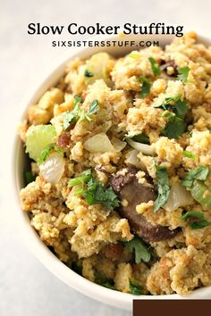 a white bowl filled with food on top of a table