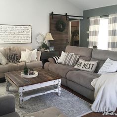 a living room with couches, chairs and a coffee table in it's center