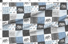 an elephant checkered fabric with the words wild thing on it and two elephants in blue,