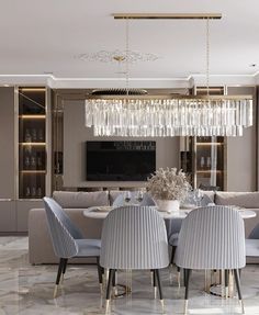 an elegant dining room with chandelier and chairs