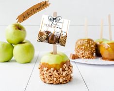 apples with caramel and nuts on top are sitting next to other desserts that include apples