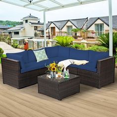 an outdoor living area with wicker furniture