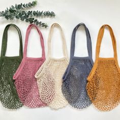 four different colored bags sitting next to each other