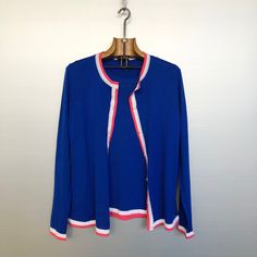 Beautiful vintage twinset by Escada. A short sleeves top and a long sleeves cardigan. Made of vibrant blue pure virgin wool with white and pink stripes. Colourfull, fun and fresh! Material is pure virgin wool Condition is : mint vintage condition   Size is M (refer to measurements) Do not hesitate to DM if you have any questions ! shoulder seam to shoulder seam : 35cm / 14in Armpit to armpit : 40cm / 16in Sleeve (shoulder seam to bottom) : 58cm / 23in Front length (collar to bottom) : 55cm /21,5