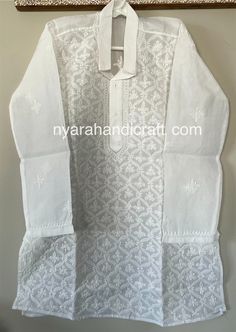 "Pure cotton Chikankari set for the little men ! This must have white Kurta Pajama set has very fine all over embroidery and \"darz\" appliqué work on the kurta." White Cotton Sets With Motifs, White Kurta With Motifs For Festive Occasions, White Bollywood Kurta With Motifs, White Chikankari Embroidery Sherwani For Festivals, White Sherwani With Chikankari Embroidery For Festivals, Diwali White Sherwani With Chikankari Embroidery, White Cotton Sherwani For Transitional Season, White Sets With Motifs For Eid, White Eid Sets With Motifs