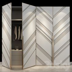 an open closet with white and silver chevroned panels on the doors, clothes hangers in the background