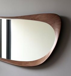 a mirror mounted to the side of a wall