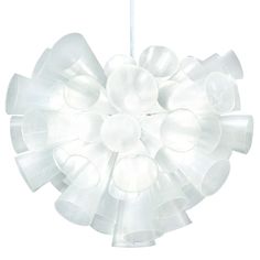 a white light that is on top of a table and has an object in the shape of a flower