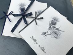 two cards with flowers and ribbons on them