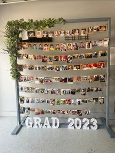 a large metal frame with pictures on it and the words grad next to it