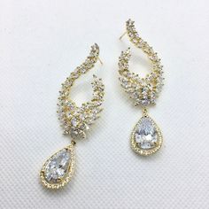 Wedding Jewelry - Cubic Zirconia Bridal Earrings - Available in Silver and Gold Cubic Zirconia Bridal Earrings, Cz Earrings, Silver And Gold, Bridal Earrings, Exquisite Design, Gold Finish, Wedding Jewelry, Wedding Gowns, Cubic Zirconia