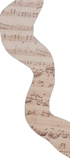 a piece of wood with music notes on it and a curved design in the middle