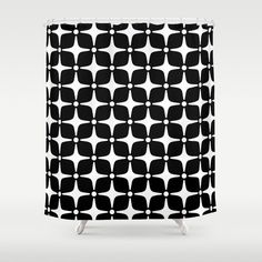 a black and white shower curtain with an abstract design