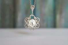 KASPER - sterling silver watch necklace -   Vintage German Ladies  silver mechanical wind up pendant Watch, mint condition, unworn The movement is in a fully working order, runs and keeps correct time. Diameter of the case:36mm Diameter of the face: 15mm 40cm length of the chain,  45cm total  17 Jewels, mechanical movement, manual winding,  0.835 silver   case , 0.925 silver chain Condition: checked and serviced, pre-owned, perfect working and cosmetic  condition, mint, unworn See more of our watches: https://www.etsy.com/shop/RetroWatchMZLtd Silver Pocket Watch With Locket For Formal Occasions, Formal Silver Locket Pocket Watch, Silver Locket Pocket Watch For Formal Occasions, Formal Silver Pocket Watch With Locket, Silver Engraved Pocket Watch For Anniversary, Engraved Silver Pocket Watch For Anniversary, Anniversary Engraved Silver Pocket Watch, Elegant Silver Pocket Watch With Polished Finish, Antique Silver Pocket Watch For Anniversary