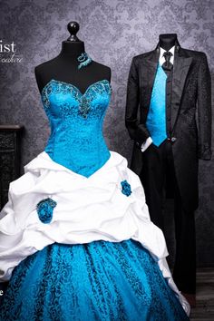 a blue and white wedding dress on display next to a tuxedo