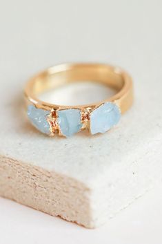 A raw aquamarine gemstone ring. Perfect as a birthstone piece of an every day wear. #danibarbe #gemstonejewelry #crystaljewelry #birthstonejewelry #womanowned #shopsmall #etsyfinds Aquamarine Birthstone Promise Ring, Aquamarine Rings With Gemstone Accents As Gift, Gift Rings With Aquamarine And Gemstone Accents, Aquamarine Birthstone Ring For Promise, Minimalist Aquamarine Rings For Anniversary, Aquamarine Gemstone Ring For Promise, Aquamarine Gemstone Promise Rings, Aquamarine Birthstone Ring With Gemstone, Modern Aquamarine Promise Ring