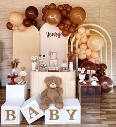 a baby shower with balloons and teddy bears