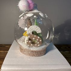 there is a snow globe with animals in it