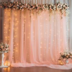 the backdrop is decorated with flowers and candles for a wedding or special event in pastel colors