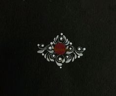 a black book with white and red designs on it