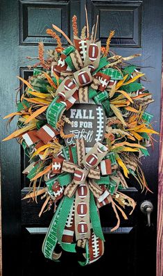 a football wreath on the front door with an all star sign and green, white and orange ribbons