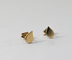 "14k solid gold drop stud earrings. This gorgeous and tiny teardrop shaped stud earrings are perfect for everyday wearing. DETAILS ABOUT THE EARRINGS, 14k solid gold drops are 6mm x5mm 14k solid gold pots and backings. On the first picture shown small bar studs on the second hole is available from this link; https://www.etsy.com/listing/736289741/14k-solid-gold-bar-stud-earrings-tiny This stud earrings were hand crafted in Melt'm Jewelry Studio in California. GIFT WRAPPING My regular package is 14k Gold Teardrop Earrings As A Gift, Minimalist Pear-shaped Earrings For Gift, Minimalist Teardrop Earrings For Anniversary, 14k Gold Pear-shaped Teardrop Earrings Gift, 14k Gold Teardrop Pear-shaped Earrings, Minimalist Teardrop Earrings As Gift, Minimalist Pear-shaped Teardrop Earrings For Gift, Simple Gold Earrings, Stud Earrings Unique