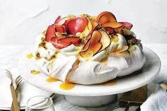 a cake on a plate with fruit toppings