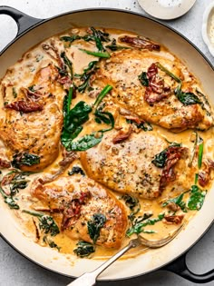 chicken with spinach and cheese in a skillet