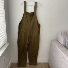 Sleeveless Jumpsuit In Army Green. New With Tags, Never Worn. #Tds237m Sleeveless Khaki Jumpsuits And Rompers For Summer, Sleeveless Khaki Jumpsuit With Pockets, Sleeveless Cotton Jumpsuits And Rompers For Work, Sleeveless Cotton Jumpsuits For Work, Sleeveless Khaki Jumpsuits And Rompers For Spring, Green Sleeveless Overalls With Pockets, Sleeveless Green Overalls With Pockets, Fitted Sleeveless Khaki Jumpsuits And Rompers, Khaki Sleeveless Jumpsuits And Rompers For Workwear