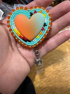 made in Chiloquin Oregon. made with miyuki seed beads, leather backed with a fresh new look.! don't miss out on this one! Heart Beaded Earrings, Beaded Badge Reel, Beadwork Ideas, Ribbon Skirt, Beaded Things