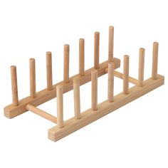 a wooden rack with six pegs in it