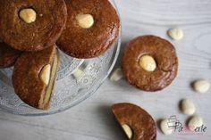 some cookies are on a glass plate with white chocolate chips