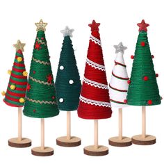 four small christmas trees on wooden sticks