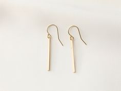 Gold Bar Earrings / Vertical Rectangle Earrings / 14k Gold Filled / Line Bar Earrings / Minimalist Jewelry / Simple Gold Earrings - Bar Length: 1.2 inches - 14k Gold Filled 1.3mm ball tip earwire earring - Sold as a pair - Material: 14k Gold Filled - Tarnish free, hypoallergenic, nickel free and safe for sensitive skin 💰 We guaranteed fair pricing on all our jewelry. 🍃 Matching Necklace + https://www.etsy.com/listing/759520329/gold-bar-necklace-14k-gold-filled?ga_search_query=Bar&ref=shop_ Gold Rectangular Linear Earrings For Everyday, Rectangular Linear Earrings For Gift, Classic Rectangular Earrings For Everyday, Oblong Everyday Earrings For Pierced Ears, Everyday Rectangular Yellow Gold Earrings, Yellow Gold Rectangular Earrings For Everyday, Rectangular Yellow Gold Earrings For Everyday, Minimalist Hypoallergenic Rectangular Earrings, Everyday Rectangular Pierced Earrings