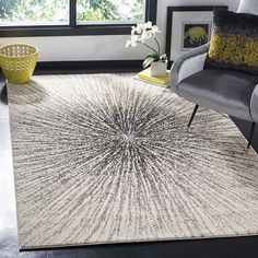 a living room with a chair and rug in it