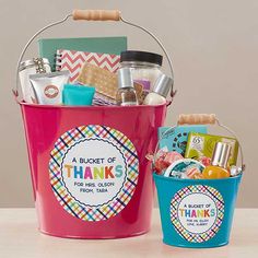 a pink and blue bucket filled with personalized items