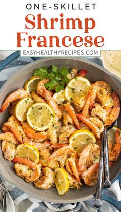 a skillet filled with shrimp and lemons on top of a blue table cloth