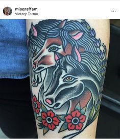 a woman's arm with a horse and flowers tattoo on the left side of her leg