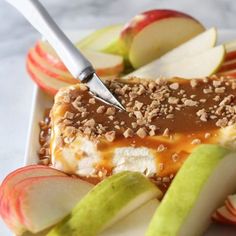 an apple dessert with caramel sauce and apples