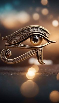 an egyptian eye is shown in gold