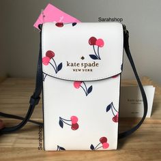 100% Authentic Kate Spade K6153 Dancing Cherry Printed North South Crossbody Cream Multi And Gold Hardware Brand New With Tags 4 1/8” (Width) X 7.5” (Height) X 1.5” (Depth) Adjustable Strap 24” Drop Trendy White Kate Spade Bag, Bags Kate Spade, Cherry Print, North South, Kate Spade Purse, Kate Spade Bags, Kate Spade Bag, Kate Spade Crossbody, Kate Spade New York