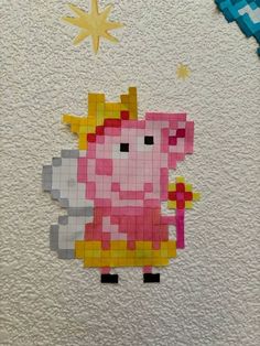 a piece of art made out of legos and paper with a pig on it