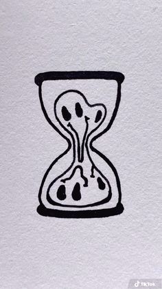 an hourglass drawing with black ink on white paper