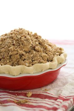 a pie sitting on top of a red and white plate