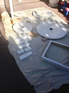 the table is covered with white plates and frames