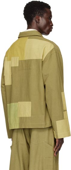 Lightweight plain-woven kaduka-dyed slub organic cotton jacket. Patchwork detailing throughout. · Spread collar · Button closure · Patch pockets · Unlined · Naturally-dyed corozo nut hardware Supplier color: Olive loved Olive Cotton Outerwear With Patch Pockets, Cotton Patchwork Utility Jacket With Long Sleeves, Cotton Utility Jacket With Patchwork, Olive Cotton Utility Jacket With Button Closure, Olive Long Sleeve Cotton Utility Jacket, Cotton Patchwork Utility Jacket, Oversized Khaki Patchwork Outerwear, Olive Military Button-up Outerwear, Khaki Military Outerwear With Multiple Pockets