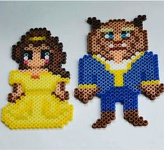 two pieces of lego art made to look like characters from beauty and the beast,